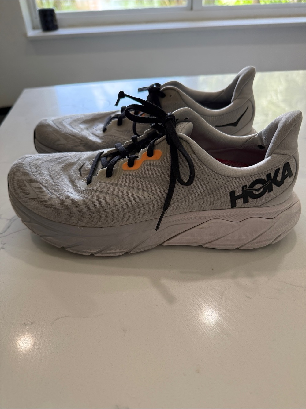 Hoka Men’s Gray Sneakers with Black Laces and Orange Accents